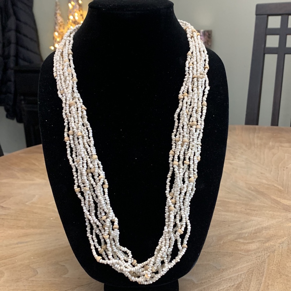 Cream/oatmeal colored multi strand beaded necklace